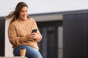 Casual Teenager Browsing Her Phone 1